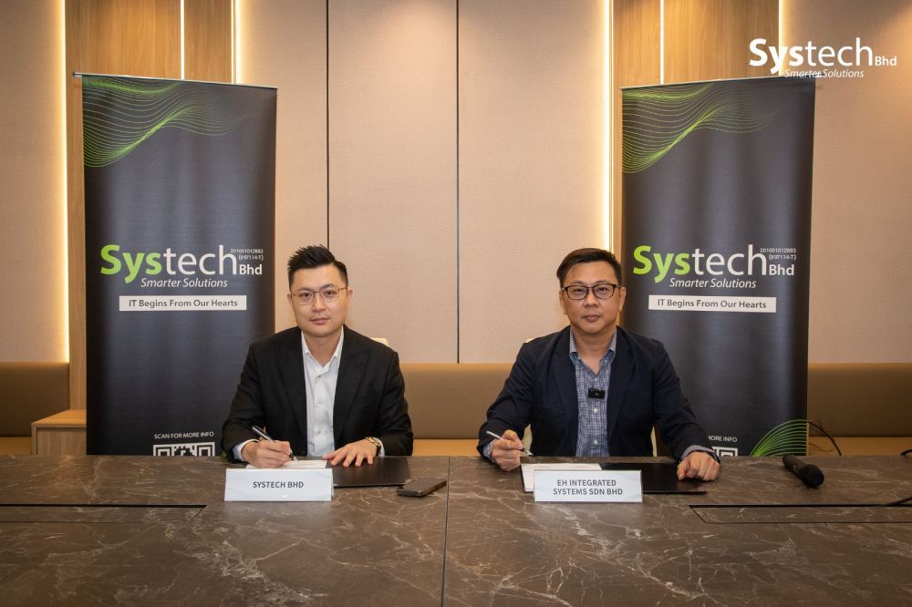 Dato' Derrick Hooi, Executive Director of Systech Berhad; Mr. Sim Chin Yee, Director of EH Integrated System Sdn. Bhd. [L–R]